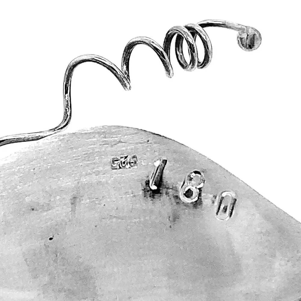 Close up of collection number of a silver piece