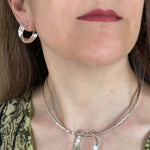 Modern Oval Hoops In Silver with model - Nueve Sterling