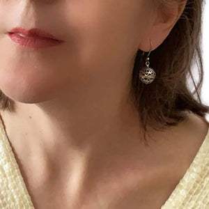 Openwork Ball Silver Earrings with model - Nueve Sterling