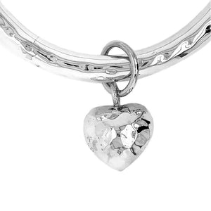 Silver Hammered Bangle With Dangling Heart details - Nueve Sterling