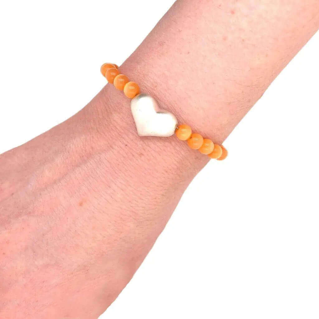 %product Silver Heart Bracelet With Orange Cats Eye Stone Nueve Sterling