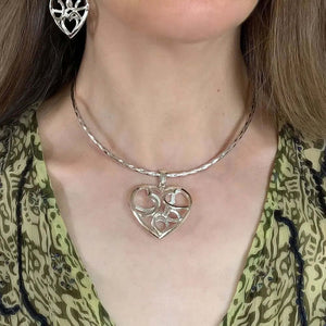 Silver Heart Pendant With A Puffed Openwork Finish with model - Nueve Sterling