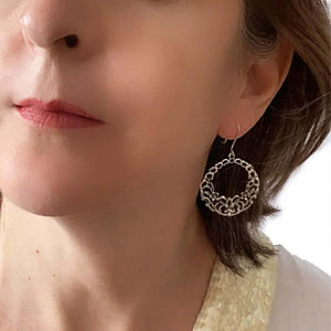 Silver Hoops With Small Flowers with model - Nueve Sterling