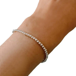 Small Silver Beads Elastic Bracelet with model - Nueve Sterling
