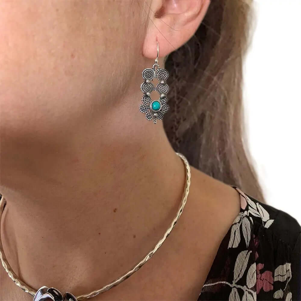 Spiral Turquoise Flower Silver Earrings with model - Nueve Sterling
