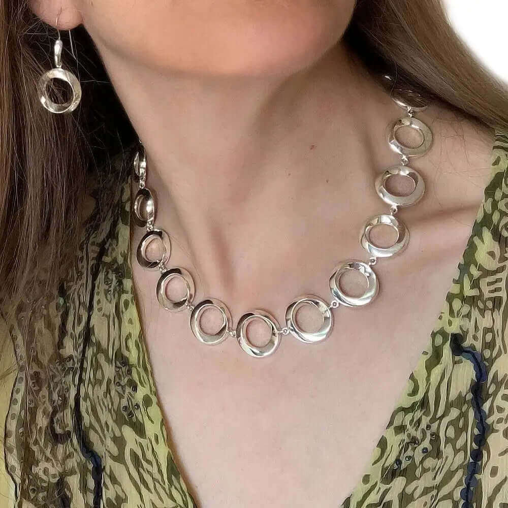 Stylized Circles Necklace In Silver with model - Nueve Sterling