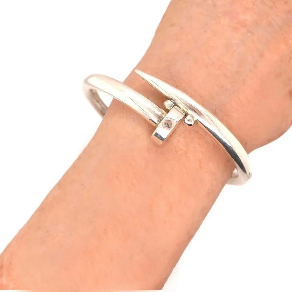 Unisex Big Nail Silver Bangle with female model - Nueve Sterling