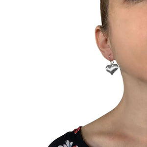 Brushed Silver Heart Earrings with model - Nueve Sterling