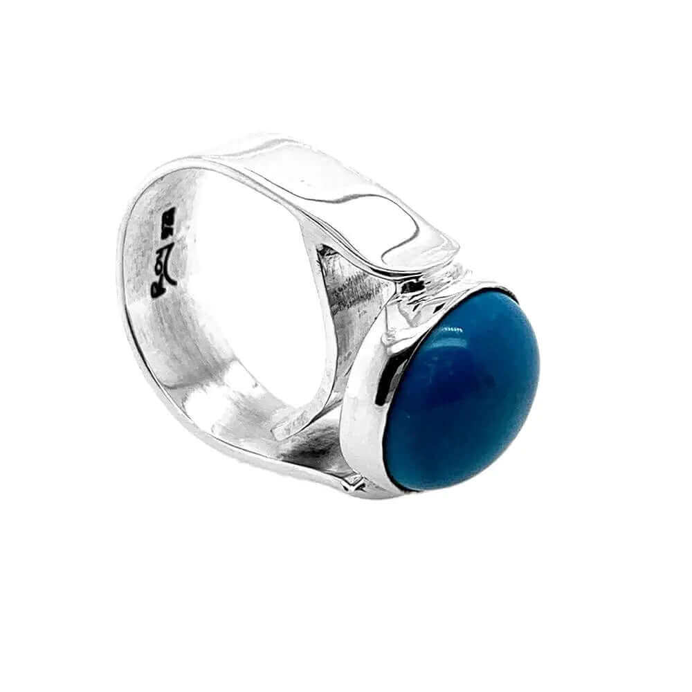 Side perspective view highlighting the thick, wavy high-purity 925 silver bezel setting and substantial band construction.
