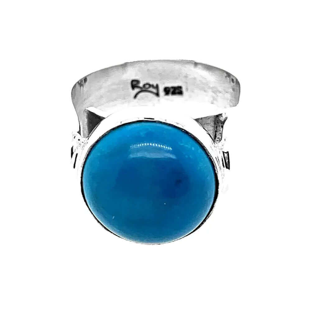 Front layout view of a handmade 950 silver statement ring showcasing an irregular, organically shaped natural turquoise gemstone.