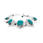 Full flat layout view of a handmade 925 sterling silver link bracelet showcasing its vibrant natural turquoise stones and high-polish finish.