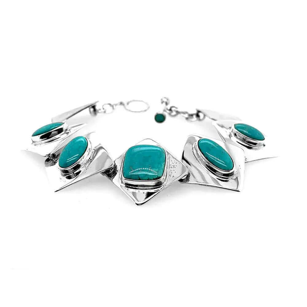 Full flat layout view of a handmade 925 sterling silver link bracelet showcasing its vibrant natural turquoise stones and high-polish finish.