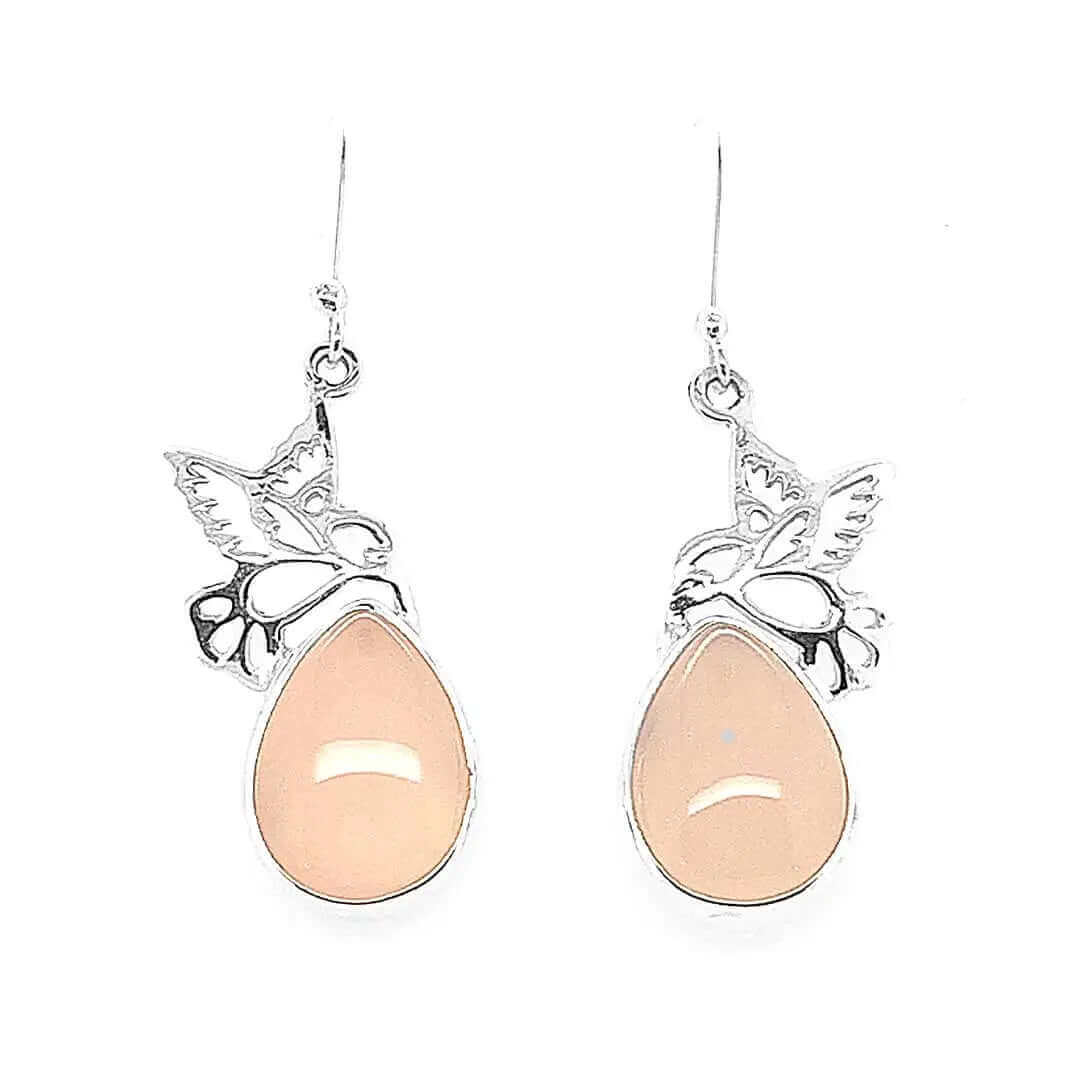 Front view of handmade 925 sterling silver drop earrings featuring detailed hummingbird motifs and oval rose quartz stones.